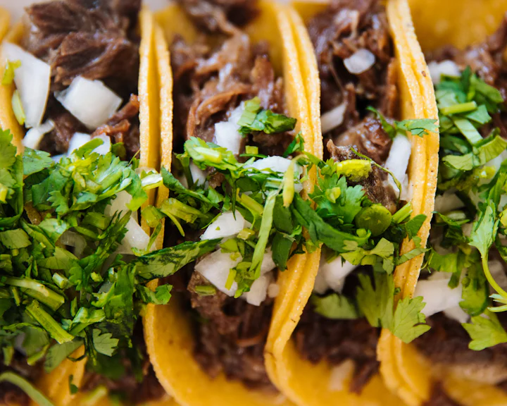 Beef tacos with onion and cilantro